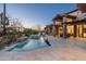 Relaxing backyard with pool, spa, lounge chairs, and view of the desert at 27914 N 100Th Pl, Scottsdale, AZ 85262