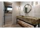 Unique powder room with a stone sink and rustic wood accents at 27914 N 100Th Pl, Scottsdale, AZ 85262