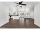 Spacious living area featuring dark floors and an open concept layout to the kitchen at 2818 E Villa Rita Dr, Phoenix, AZ 85032