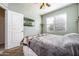 Inviting bedroom features a soft color palette, window with blinds and carpeted floors creating a tranquil and cozy retreat at 2922 W Kowalsky Ln, Phoenix, AZ 85041