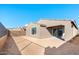 The backyard features a covered patio and stucco wall, offering a private outdoor space at 31672 N 135Th Ln, Peoria, AZ 85383