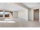 Spacious living room featuring tile floors and sliding glass doors to the patio at 31672 N 135Th Ln, Peoria, AZ 85383