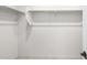 Spacious walk-in closet featuring built-in shelving and ample storage space at 31672 N 135Th Ln, Peoria, AZ 85383