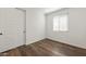 Bedroom features a window with blinds, a closet with sliding doors, and LVP flooring at 32076 N 136Th Ave, Peoria, AZ 85383