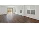 Bright living room featuring hardwood floors, sliding glass doors, and desert views at 32076 N 136Th Ave, Peoria, AZ 85383