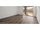 Bright patio featuring hardwood floors, sliding glass doors, and desert views at 32076 N 136Th Ave, Peoria, AZ 85383