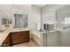 Bathroom with a glass-enclosed shower, bathtub, and vanity with sink at 3431 S Felix Way, Chandler, AZ 85248