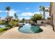 Luxurious pool with rock waterfall detail, overlooking the serene lake at 3431 S Felix Way, Chandler, AZ 85248