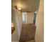 Clean hallway with carpet and access to other rooms at 3613 W El Caminito Dr, Phoenix, AZ 85051