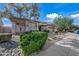 Well-maintained single-story home with a stone landscape, mature trees, and a pristine exterior at 4503 E Robin Ln, Phoenix, AZ 85050