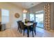 Dining area with a table, chairs, and a sliding glass door to the backyard at 4576 W Agave W Ave, Eloy, AZ 85131