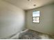 Well-lit bedroom with a large window offering scenic views and ample natural light at 47747 W Kenner Dr, Maricopa, AZ 85139