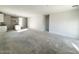 Open-concept living area with kitchen island and natural light, great for entertaining at 47747 W Kenner Dr, Maricopa, AZ 85139