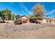 Spacious exterior view of landscaped front yard, colorful foliage, and a charming home exterior at 62 W Secretariat Dr, Tempe, AZ 85284