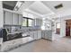 Bright kitchen featuring granite countertops, white cabinetry, and stainless steel appliances at 62 W Secretariat Dr, Tempe, AZ 85284