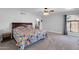 Spacious main bedroom with carpet flooring, ceiling fan, and an en-suite bathroom at 62 W Secretariat Dr, Tempe, AZ 85284
