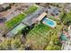Aerial view of a private backyard featuring mature landscaping, a pool, and a sports court at 620 W Mclellan Blvd, Phoenix, AZ 85013
