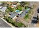 Aerial shot of a home with a pool, sports court, mature landscaping, and a well-maintained lawn at 620 W Mclellan Blvd, Phoenix, AZ 85013