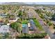 Stunning aerial view of a neighborhood showcasing mountain views, mature trees, and a well-maintained property at 620 W Mclellan Blvd, Phoenix, AZ 85013