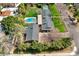 Aerial view of a home highlighting its private backyard, mature landscaping, pool, and sports court at 620 W Mclellan Blvd, Phoenix, AZ 85013