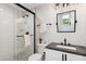This bathroom has a walk-in shower and modern fixtures and finishes at 620 W Mclellan Blvd, Phoenix, AZ 85013