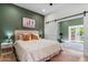 The bedroom offers a view of the exercise room through a sliding barn door at 620 W Mclellan Blvd, Phoenix, AZ 85013