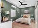 Stylish bedroom with a modern ceiling fan, a comfortable bed, and trendy decor for a cozy retreat at 620 W Mclellan Blvd, Phoenix, AZ 85013