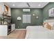 The bedroom features a stylish wet bar area, wood floors, and soothing green walls at 620 W Mclellan Blvd, Phoenix, AZ 85013