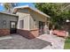 Exterior view of the bonus living quarters with a brick base and outdoor seating area at 620 W Mclellan Blvd, Phoenix, AZ 85013