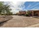 Beautiful circular driveway surrounded by mature trees and lush landscaping at 6336 N 48Th Pl, Paradise Valley, AZ 85253