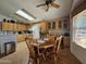 Bright, open kitchen with charming breakfast nook, warm wood cabinetry, and abundant natural light at 650 N Hawes Rd # 4716, Mesa, AZ 85207