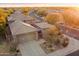 An aerial view of the home featuring desert landscaping, and a private gated entrance at 7111 E Sienna Bouquet Pl, Scottsdale, AZ 85266