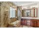 Beautiful bathroom with a luxurious soaking tub and glass shower, complemented by marble accents at 7111 E Sienna Bouquet Pl, Scottsdale, AZ 85266