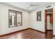 Bedroom with wood floors, ceiling fan, windows and a wardrobe at 7111 E Sienna Bouquet Pl, Scottsdale, AZ 85266