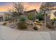 Beautifully landscaped front yard with desert plants, gravel, and rocks at 7111 E Sienna Bouquet Pl, Scottsdale, AZ 85266