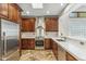 Kitchen boasts stainless steel appliances and beautiful wood cabinetry at 7111 E Sienna Bouquet Pl, Scottsdale, AZ 85266