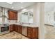 Kitchen featuring stainless steel appliances, wood cabinets, and granite counters at 7111 E Sienna Bouquet Pl, Scottsdale, AZ 85266