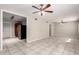 Bright and airy living room with tile flooring and ceiling fans, creating a comfortable and inviting space at 7313 N 55Th Dr, Glendale, AZ 85301