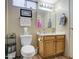 Bathroom features a toilet, modern vanity, and a framed mirror at 7408 E Bosaga Way, Mesa, AZ 85208