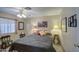Cozy bedroom featuring a comfortable bed, lamps, decor, and natural light creating a relaxing atmosphere at 7408 E Bosaga Way, Mesa, AZ 85208