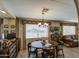 Cozy dining area with room for gathering, natural light, and easy access to the living room at 7408 E Bosaga Way, Mesa, AZ 85208