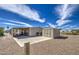 Exterior view of a home with a covered patio, a grill, and a handy storage shed at 7408 E Bosaga Way, Mesa, AZ 85208