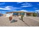 Charming home with low maintenance desert landscaping, covered parking, and ample curb appeal at 7408 E Bosaga Way, Mesa, AZ 85208