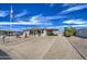 Inviting single-story home with easy-care landscaping, a convenient carport, and plenty of parking at 7408 E Bosaga Way, Mesa, AZ 85208