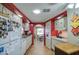 Bright and open kitchen featuring white cabinets and a view through to another room at 7408 E Bosaga Way, Mesa, AZ 85208
