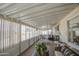 Sun room featuring natural light, plants, and cozy furniture to relax and soak up the sun at 7408 E Bosaga Way, Mesa, AZ 85208