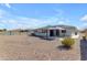 Spacious backyard with decorative rocks, offering ample space for outdoor activities and relaxation at 8064 E Madero Ave, Mesa, AZ 85209
