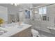 This bathroom features a glass-enclosed shower, vanity with white countertop, and tile accents at 8064 E Madero Ave, Mesa, AZ 85209