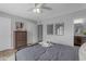 Calm bedroom with a large bed, ample closet space, and a view of the attached bathroom at 8064 E Madero Ave, Mesa, AZ 85209