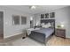 Comfortable bedroom with contemporary decor, including artwork and coordinating nightstands at 8064 E Madero Ave, Mesa, AZ 85209